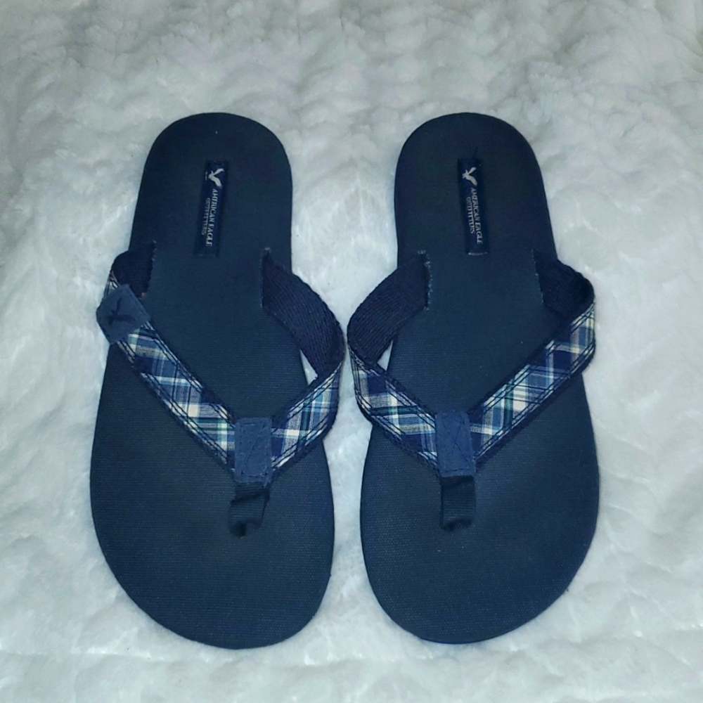 Never worn blue American Eagle flip-flops.